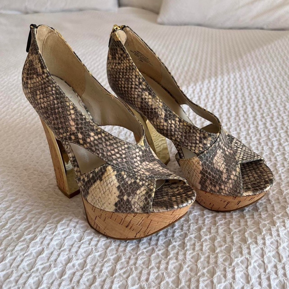 Nine West heels snake skin styled heels.
